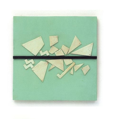 Assemblage. Thin, ivory-white, geometric pieces are nailed like a surreal and mismatched puzzle onto a cool green board. A black band spans the middle of the piece.