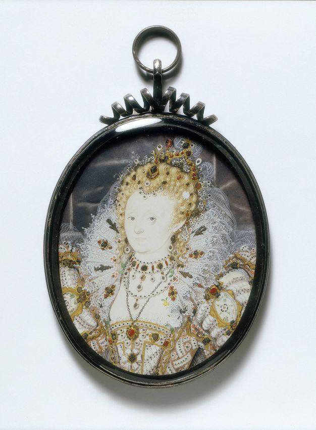 Watercolour. This oval painting shows Elizabeth I with notably pale skin. Her blond hair is piled high on her head and encrusted with jewels under a crown. Her elaborately embroidered bodice and puffed sleeves are also sewn with jewels. She wears several necklaces, and her head is framed by a full, high, lace ruff.