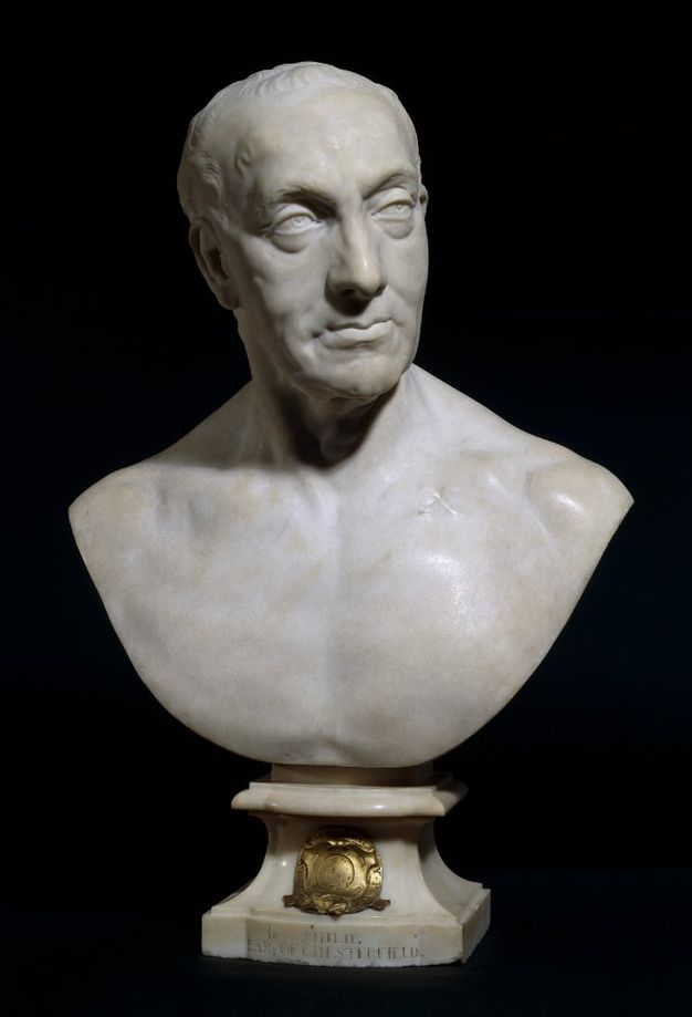 Sculpture. Marble bust shows head and shoulders of a man who has a receding hairline, deep-set eyes, and a prominent nose set in a long, oval face. His upper lip curls, perhaps about to smile. His skin sags under his eyes and over his cheekbones.