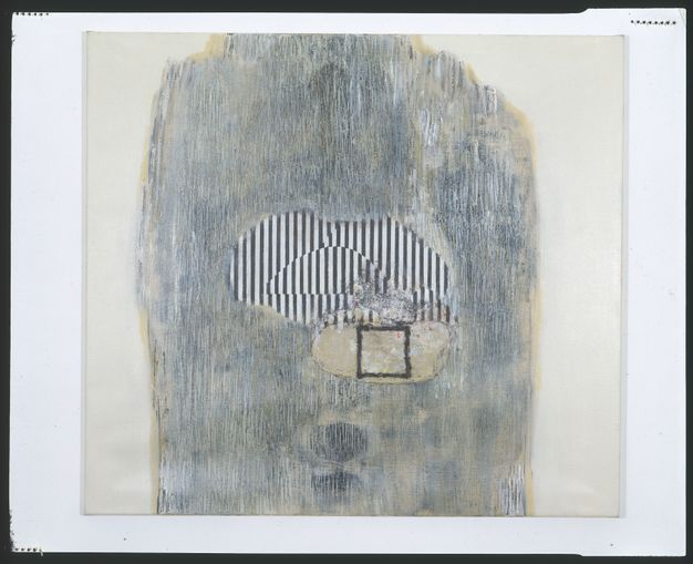 Painting. A rough oval at the centre of this composition is striped with black and white. The pattern shifts in a half-circular area within the oval, creating an optical effect. A form like a cape draped from the top edge of the painting is scraped and rubbed to create a slate-blue and parchment-white cloud.