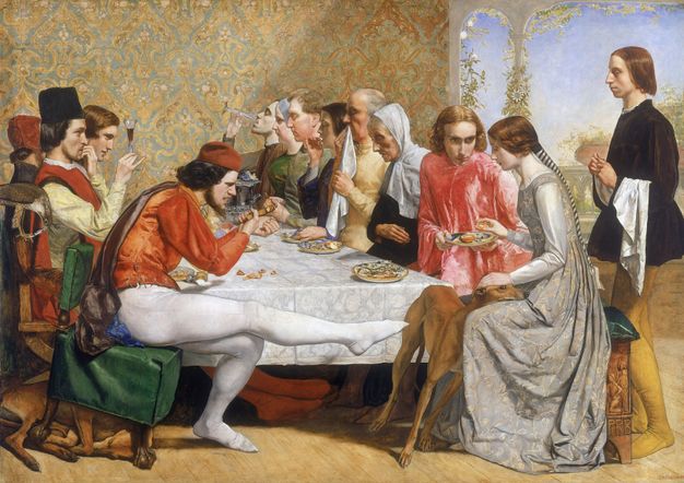Painting. Twelve men and women, all with pale skin, sit around a table, eating and drinking. Closest to us to our left, a bearded man stretches one, white-stockinged leg to kick at a dog, perhaps a greyhound. The dog rests its head in the lap of a woman, Isabella, who wears a long, silvery grey gown. A clean shaven man next to her, Lorenzo, offers a plate holding a cut orange.