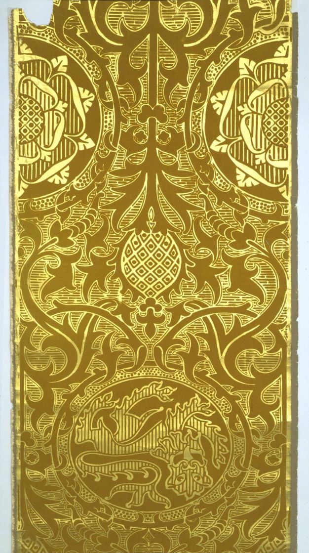 Print. In shiny gold against a harvest yellow background, stylized rosettes and heraldic lions are surrounded by leafy vines.