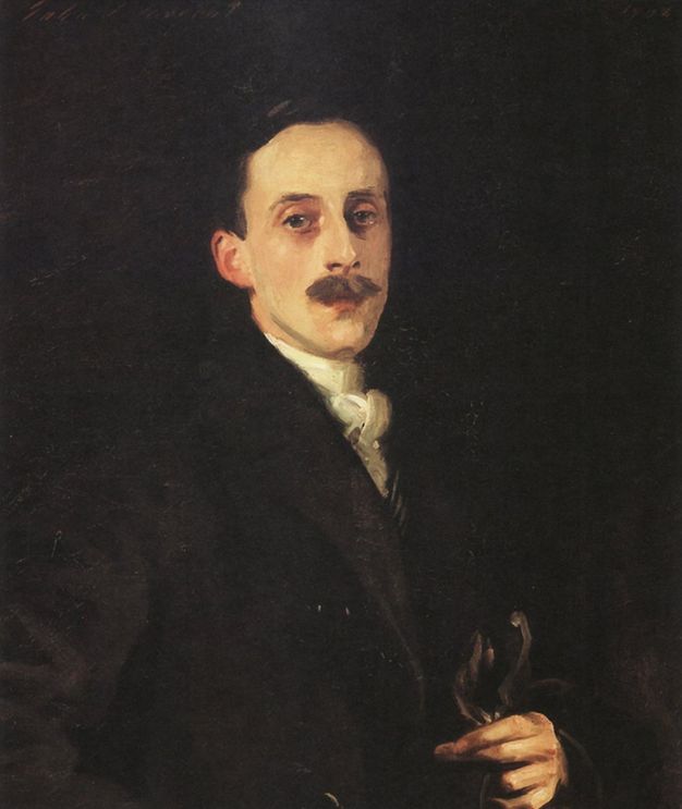 Painting. Shown from the waist up, a pale-skinned man, Hugh Lane, faces and looks at us against a dark background. He has an oval face, a long nose, and a bushy moustache. His dark hair and black coat blend into the shadowy background, and he holds gloves in one long-fingered hand.
