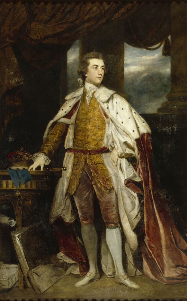 Painting. A man wearing a golden yellow suit and a voluminous fur, velvet, and silk cape stands looking off to our right. He is clean shaven and has delicate facial features. One hand rests on a tabletop near the hilt of a sword. Papers and books are stacked and propped up against the table. In the background, a curtain opens onto columns framing a cloudy sky.