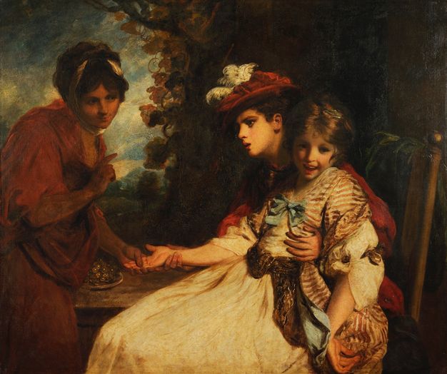 Painting. A smiling girl wearing a long dress sits on the lap of a boy, who wears a red, brimmed, floppy hat adorned with white feathers. The pair have pale skin. The boy holds the girl’s hand out for the inspection of a fortune teller, to our left. The fortune teller, a young woman, has black hair and a dark complexion, and she tips her head and smiles at the couple.