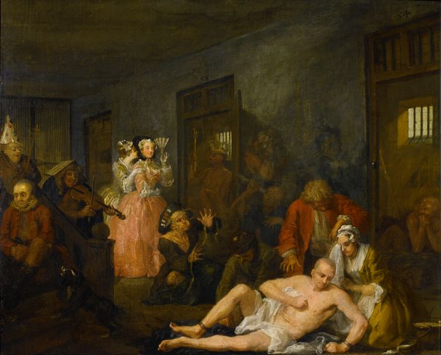 Painting. Twelve men and three women, all with light skin, are in a cramped room. Three doors lead to cells off the main room with barred windows. The men sit or writhe miserably, or mime being a tailor, astronomer, pope, king, or navigator. A woman tending to one man wipes her eyes with a handkerchief. The other women look on, as if visiting a zoo.
