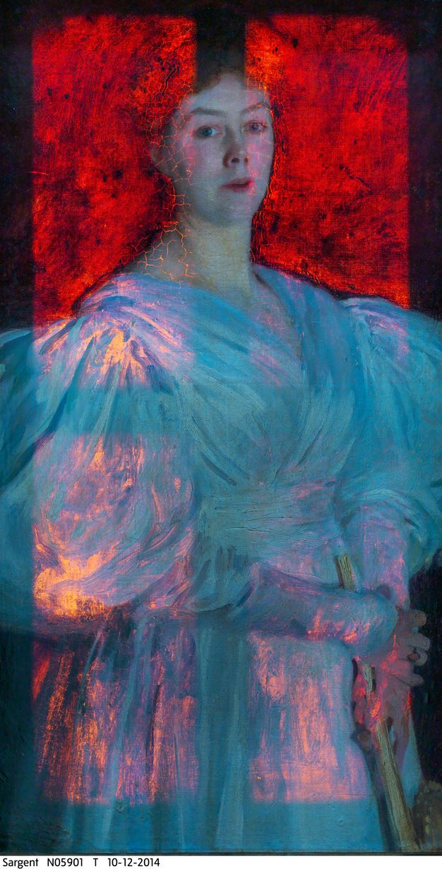 Colour photograph. A portrait shows a woman from the hips up, wearing a puffed sleeve dress. The canvas is lit from behind so her white dress looks like fiery opals. The background behind her is luminous red.