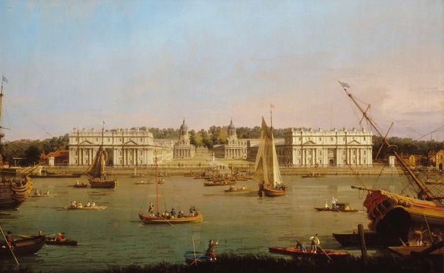 Painting. From the far side of a river, we look at two long, boxy buildings coming towards us on either side of a plaza in this wide, sunny landscape. Smaller structures at the back corners of the plaza have two levels of colonnades under domes. Beyond a fringe of grass, rowboats and sailboats move along the river in front of us.