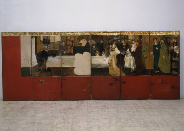 Painted screen. A banquet scene with about twenty pale-skinned women, men, and children spans six wooden panels. In the painting, a grey-haired man sits at the left end of a long table covered in a shiny white tablecloth. Others stand or sit at the table, mostly clustered around the other end. More enter the room from a doorway to our right. The women wear long gowns, and the men wear suits. The painting starts halfway through the first panel to our left, and covers the top two thirds of the panels, which otherwise have a rich brick red background colour.