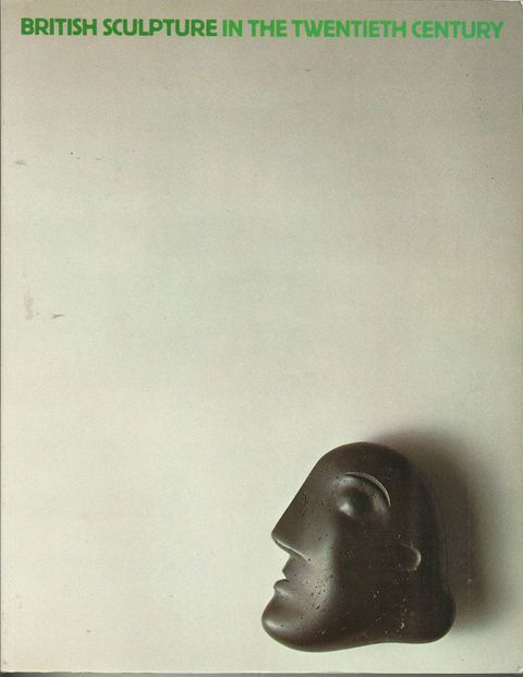 Cover of an exhibition catalogue. A black stone head rendered in an abstract style is in the lower right corner of the cream-white page. The exhibition title is the only text, which appears in sans serif capitals along the top edge of the page in kelly green.