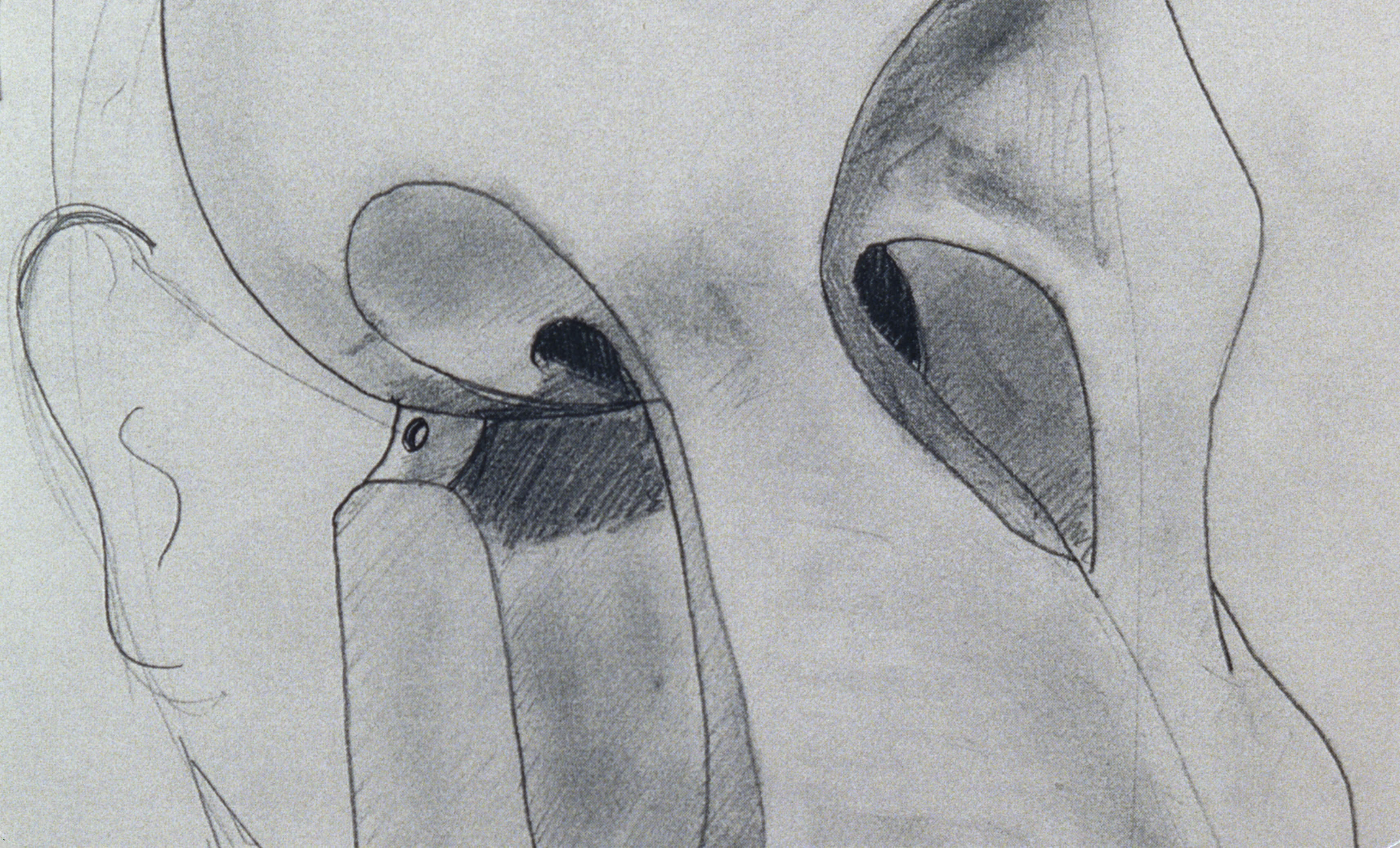Film still. Detail view of a drawing showing an abstracted face from the eyebrows to the nose. A squiggle to our left suggests an ear next to exaggerated hollows for what might be eyes.