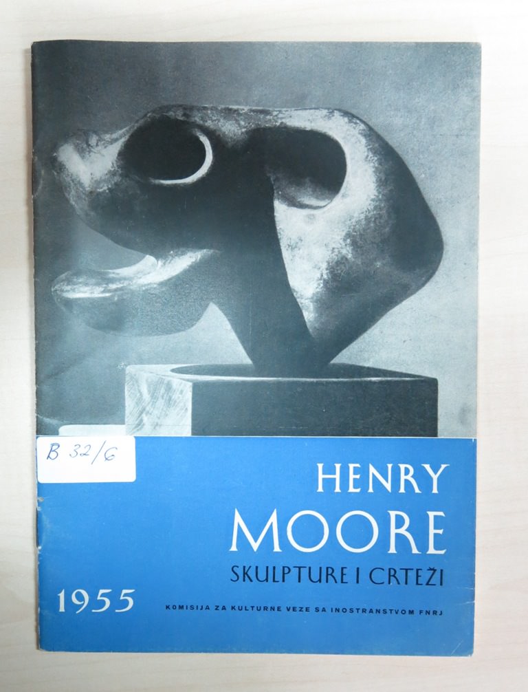 Book cover. The top two thirds is a black and white photograph of a rounded, abstracted bronze sculpture. The bottom zone is blue.