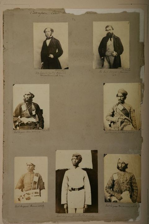 Page of a book. Each of seven black and white photographed portraits shows a man from about the thighs up. The two men at the top of the page have pale skin. The other five have darker skin and wear turbans.