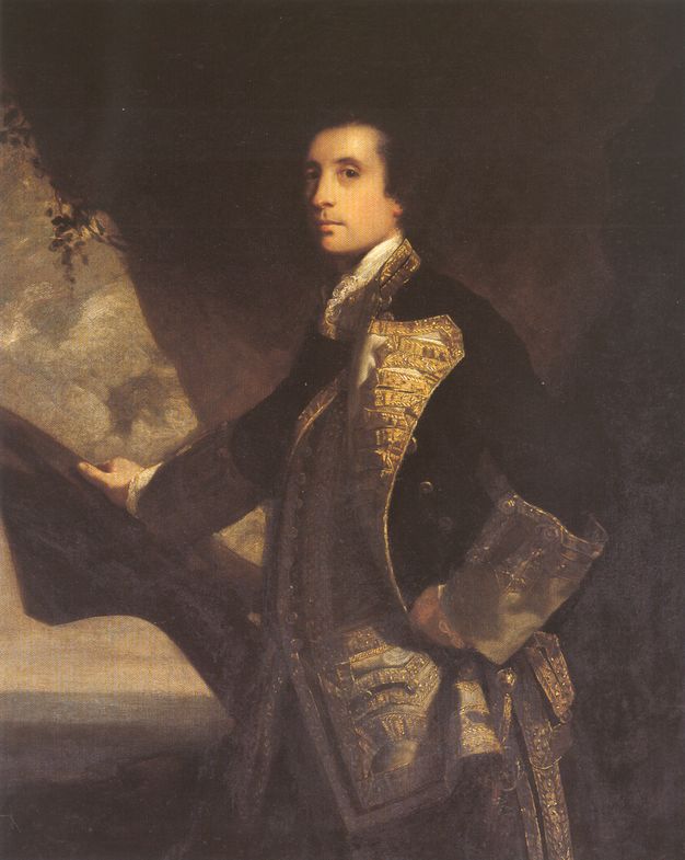 Painting. Shown from the hips up, a pale-skinned man stands in front of a seaside landscape with his body facing our left, but he turns to look mildly at us from the corners of his dark eyes. His dark hair blends into the rock behind him. His military coat has wide, gold lapels and cuffs, and it falls open over a gold waistcoat.