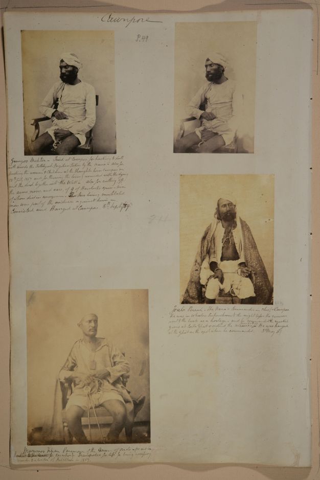 Page of a book. Four black and white portraits of men with dark skin sitting with their hands chained. Lines of handwritten notes are under three of the photographs.