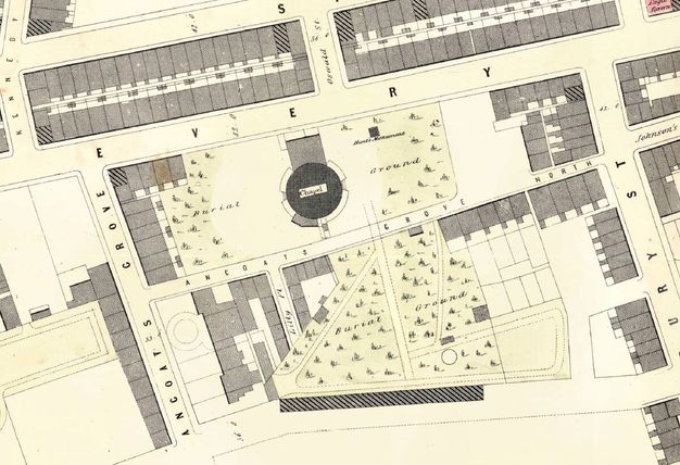 Map. A round chapel is surrounded by spaces marked as “Burial Ground”. Buildings fill the remaining spaces between the streets.