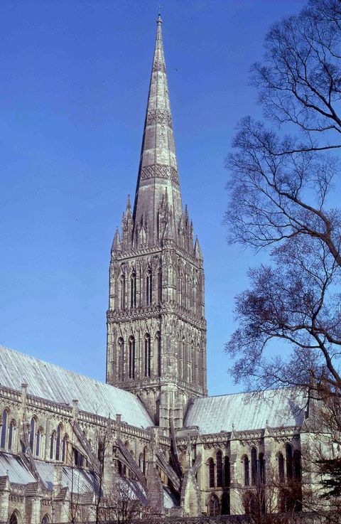 Architecture. A square tower over the crossing of a cathedral is topped with a spire at least as tall as the tower itself.