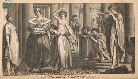 Print. Two women dance as two men play drums and a third man plays a pipe. Both women wear voluminous ruffs around their waists over long, full skirts and bare feet. One woman wears a turban and a gauzy material over her breasts. The other is bare-headed and bare-chested.