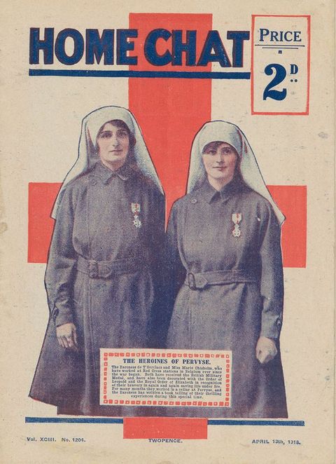 Cover of a magazine. Two women wearing uniform overcoats and white head coverings are shown against a red cross. Each has a medal on a short ribbon pinned to her coat. The magazine title is above, “Home Chat Price 2D”. Text in an inset box near the bottom of the cover begins, “The Heroines of Pervyse”.