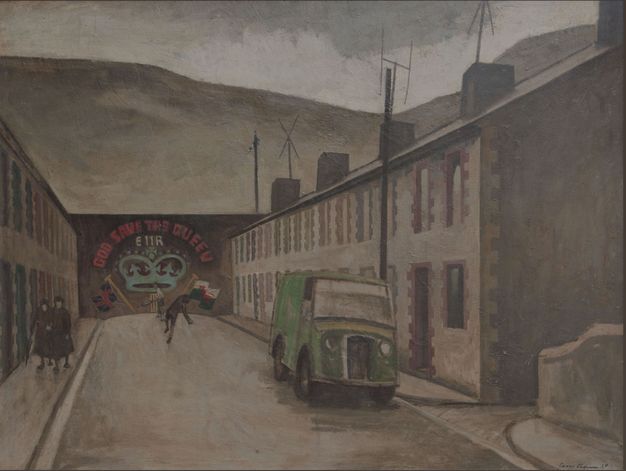 Painting. Enveloped in a brown haze, a view down a street ends at a wall painted with a mural reading “God Save the Queen” over a crown. Steep hills rise behind the wall. A green truck is parked to our right, and two women walk towards us to our left. Two people play cricket against the wall.