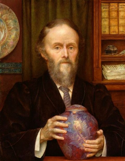 Painting. Shown from the waist up behind a ledge, a pale-skinned man wearing a velvet jacket over a shirt and tie holds an iridescent purple, covered jar in both hands.