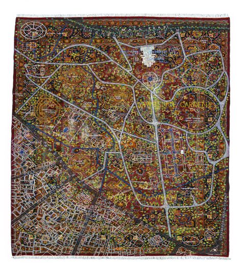 Textile. A map of Lawrence Gardens is embroidered over a carpet patterned with brick red, marigold orange, blue, and green. The streets, walkways, and buildings on the map are mostly white with some blue. The location, “Lawrence Gardens”, is in yellow to the top right. Bushes or trees are represented as dots of lime green. The pattern of the carpet is disguised by the density of the streets and especially the green dots.