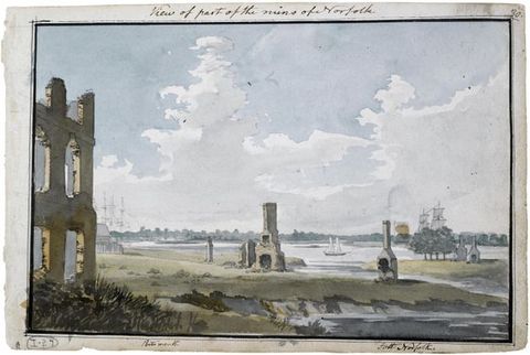 Watercolour. The remains of a few structures and chimneys dot flat, marshy land cut through with a river. A ship and sailboat are on the river beyond. White clouds seep across the pale blue sky above.