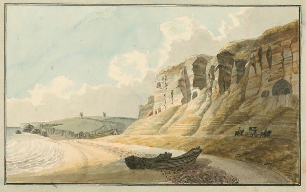 Watercolour. Sheer, striated cliff faces loom across the right half of this horizontal landscape. A beach sweeps across to the left half, and two rowboats are pulled up onto the sand in the lower centre of the composition. Two windmills sit on the horizon on laurel-green hills in the distance.
