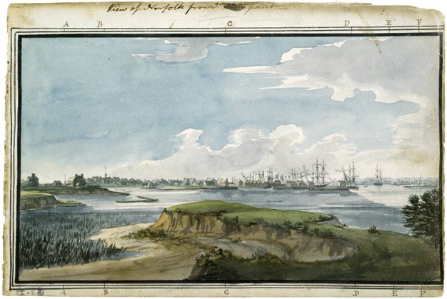 Watercolour. We look across a marshy-lined river from grass-topped dunes at tiny buildings and a forest of ships’ masts along the horizon.