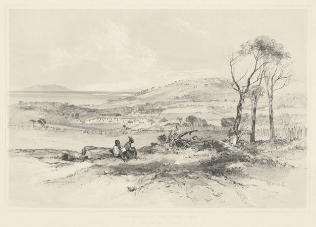 Print. Two dark-skinned people sit near a fallen tree. The land drops down to a river beyond and hills roll up in the distance. Most of the lithograph is shaded lightly in silvery grey, and the area closest to us has darker tonalities.