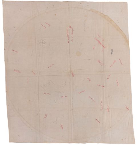 Tablecloth. A white cloth is signed with about thirty-five names or inscriptions in red or black. Some are blurred as if by water. Most are not legible, save an all-caps “Jake” near the top right.
