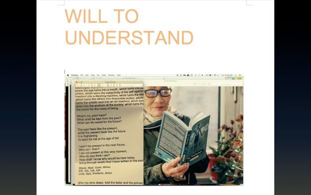 A screenshot with layered windows has a picture of a woman wearing glasses and reading a book. The cover is blue, and the title can just be made out, “The Posthuman”. A sheet of folded paper with text is to our left.