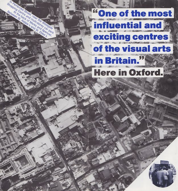 Leaflet. A black and white aerial view of a town is overlaid with the title in blue type. Below that, black text reads, “Here in Oxford”. An arrow points to a building near an intersection in the top left quadrant. Text on the arrow reads, “In Pembroke Street, near the Westgate Shopping Centre and multi-storey car park At the back of Marks and Spence, Between St. Aldate’s and St. Ebbe’s”.