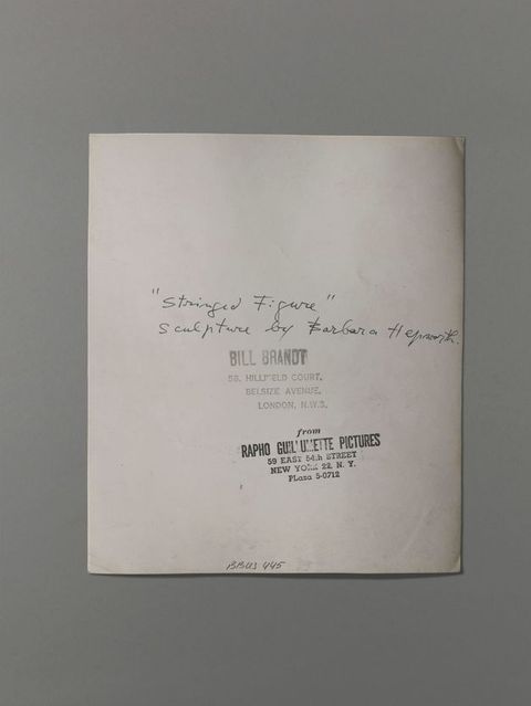 The back of a photograph has the title written in pen and two stamps. One stamp reads “Bill Brandt 58, Hillfield Court. Belsize Avenue. London. N.W.3” and the other, “from Rapho Guillemette Pictures 59 East 54th Street New York 22, N.Y. PLaza 5-0712”.