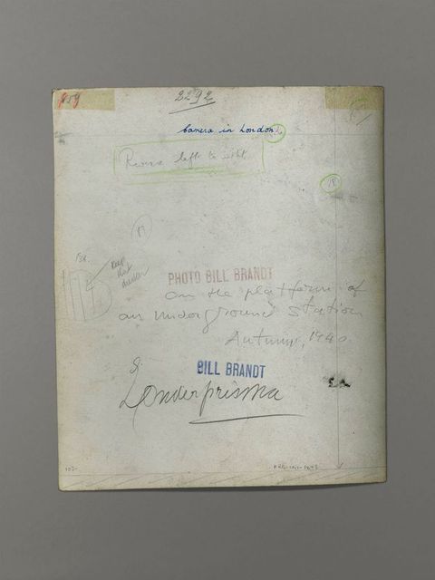 The back of a photograph has handwritten notes in pen and pencil. Two stamps read “Bill Brandt” and “Photo Bill Brandt”.