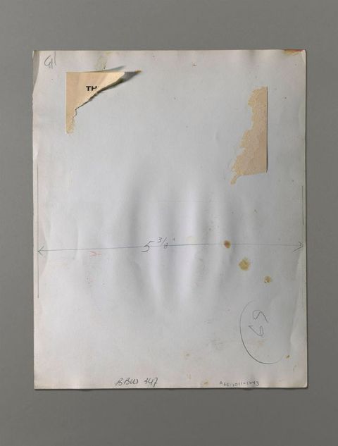 The back of a photograph has a dimension marked across its width, “5 3/8””. A label is mostly torn off above.