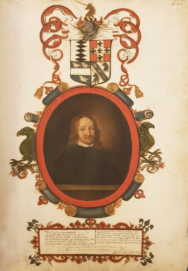 Painting. A pale-skinned man wearing black is shown from the waist up behind a ledge within an oval frame. His brown hair hangs to his shoulders, and he has a moustache over the hint of a double chin. The frame is painted with scrolls and eagles under a heraldic shield. Handwritten text appears in a cartouche below.