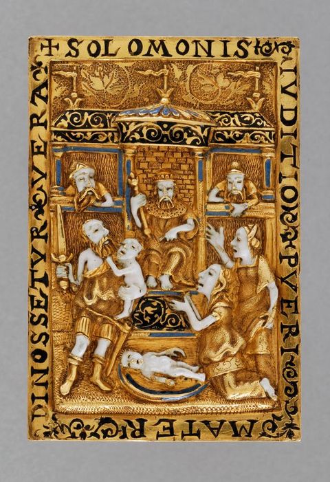 Book cover. In low, gold relief, a man sits on a throne in a temple-like structure. To our right, two women reach out, mouths open, towards a man holding a sword in one hand and a baby in the other. Another baby lies between the man and women. The skin of all the figures is white enamel, and a few architectural details are picked out in black or blue enamel.