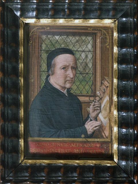 Watercolour. Shown from the waist up, a pale-skinned, clean-shaven man sits at a tilted surface, a pair of pince-nez in one hand. He looks off to our right with a furrowed brow, and his lips droop into wrinkles that line his chin.