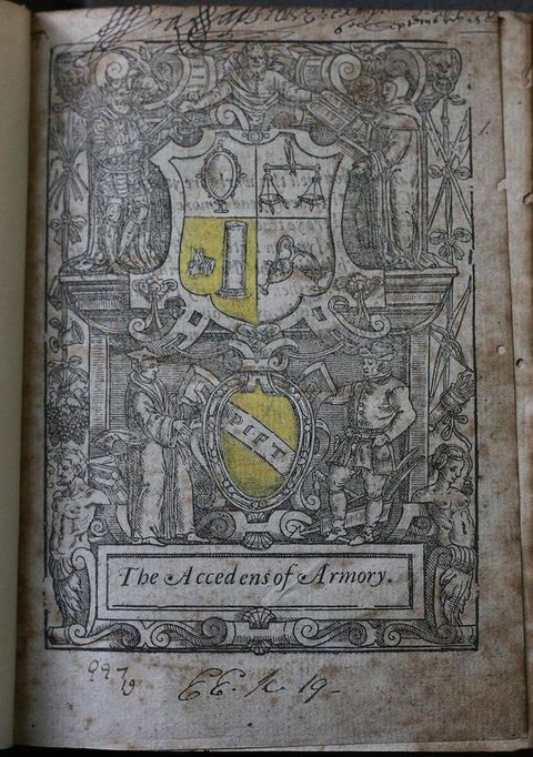 Title page. A coat of arms and shield are surrounded five people within an intricate design of ornamental strapwork, scrolls, and still life elements including foodstuff and weapons. Handwritten inscriptions are above and below the illustration.