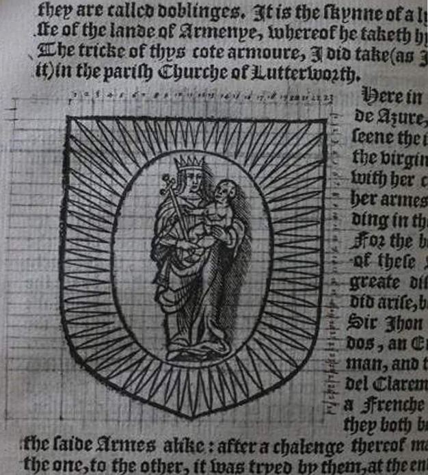 Page of a book. Detail view of an illustration of a crowned woman holding a baby. Both are in a sunburst contained within a shield shape. A grid of pencil lines creates a net over the surface. Black Gothic text surrounds the illustration.