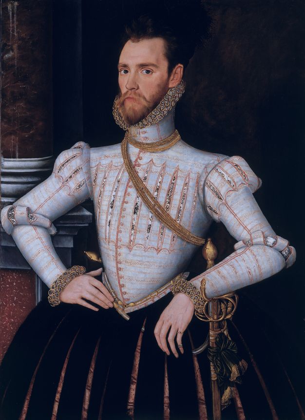 Painting. A pale-skinned man wearing a sky-blue jerkin and black puffed, slitted breeches stands in front of a column against an otherwise black background. He looks at us from the corners of his dark eyes, and his narrow, pointed chin rests in a ruff of pleated figure-eights.