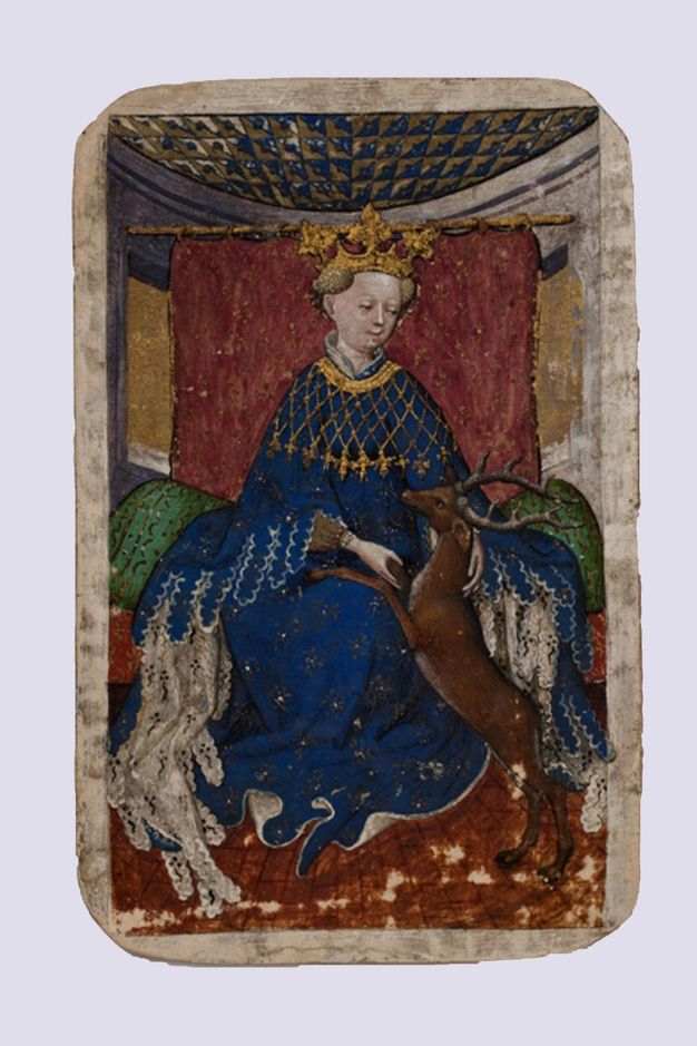 Playing card. A brown stag rests its front feet in the lap of a pale-skinned, crowned woman sitting on a throne. She wears a lapis-blue robe decorated with gold. A burgundy-red cloth hangs behind her.