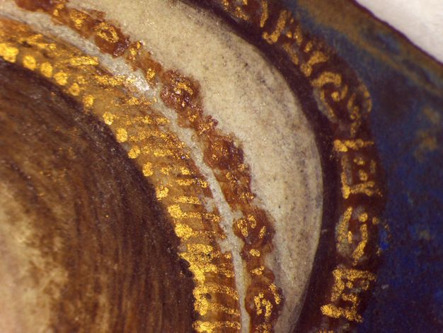 Watercolour. Detail view of short gold lines against brown bands separated by ivory white. Blue is to our right, brown hair to our left.