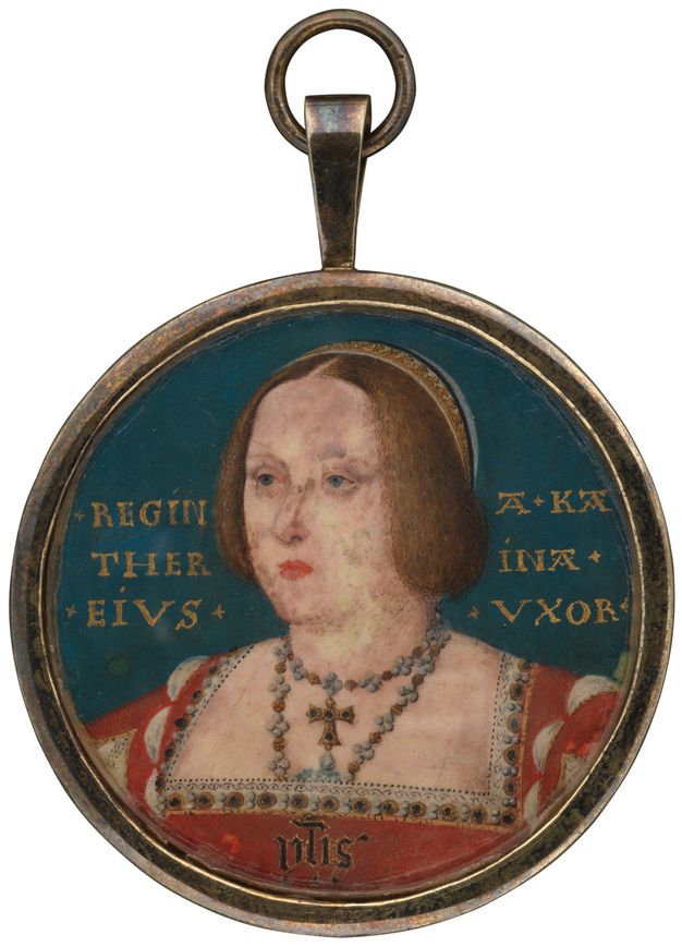 Watercolour. A pale-skinned woman with wide-set, small blue eyes looks off to our left. Her brown hair hangs in two lobes to frame her round-cheeked face over her thick neck. She wears gold jewellery set with pearls and gems, and jewels line the square neckline of her red dress. The round portrait is in a simple frame.