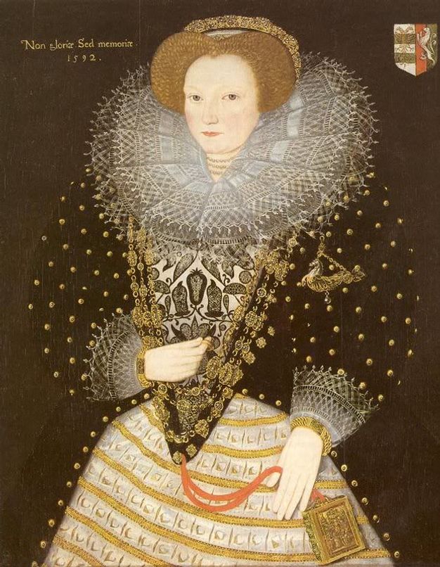 Painting. Shown from the thighs up, a pale-skinned woman with ash-blond hair stands in front of a brown background. Her lacy, pleated ruff is wider than her shoulders, and the puffy sleeves of her black dress double her width. A hand-sized book hangs from a red ribbon from the bottom of her bodice.