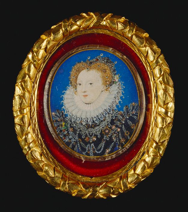 Watercolour. Shown from the waist up, a pale-skinned woman wears a bejewelled dress and crown. Pearls are set in her rose gold-blond hair, and one wisp curls on to the pleated lace ruff that surrounds chin and back of her head. The portrait is set in a gold, oval frame.