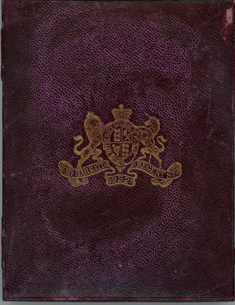 Case. A royal-purple rectangular leather case stamped with a gold insignia. A lion and unicorn flank a crowned coat of arms.