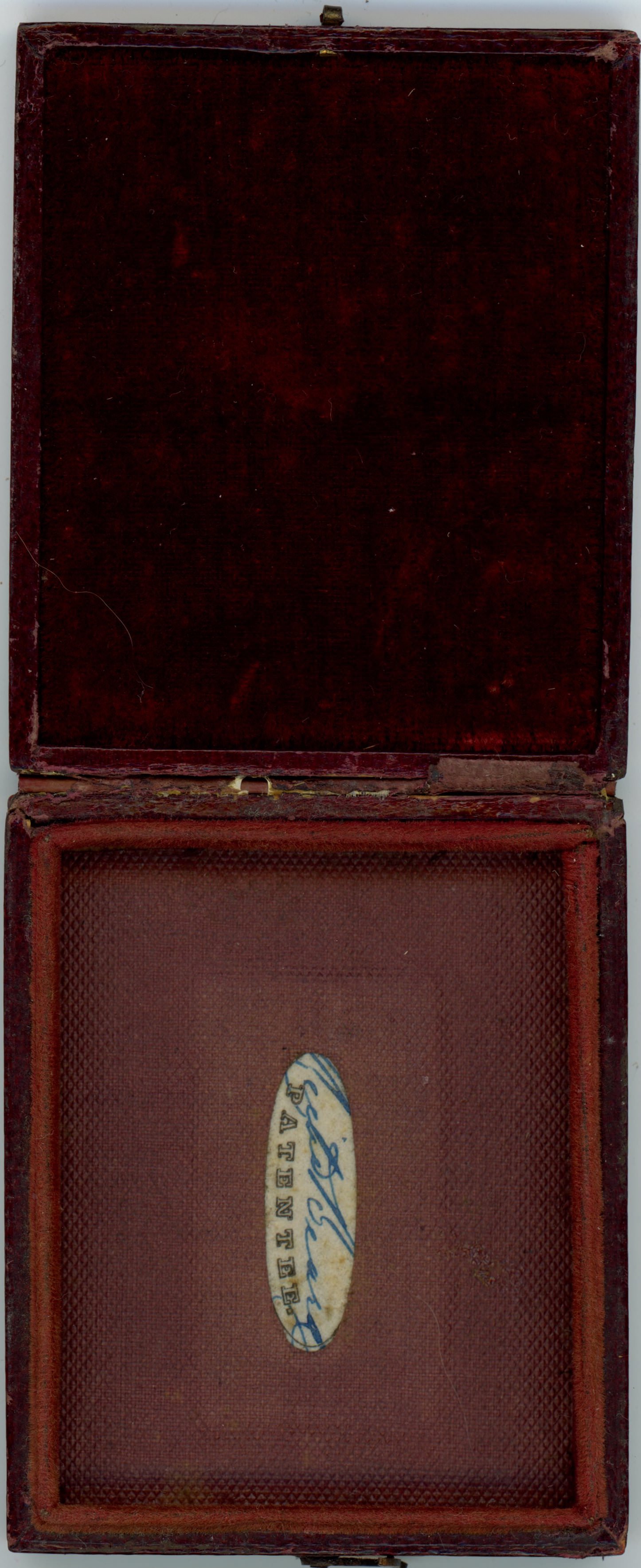 Case. Burgundy-red case is lined in the cover with red velvet and the bottom has a long, oval label signed by Beard and printed with the word “Patentee”.