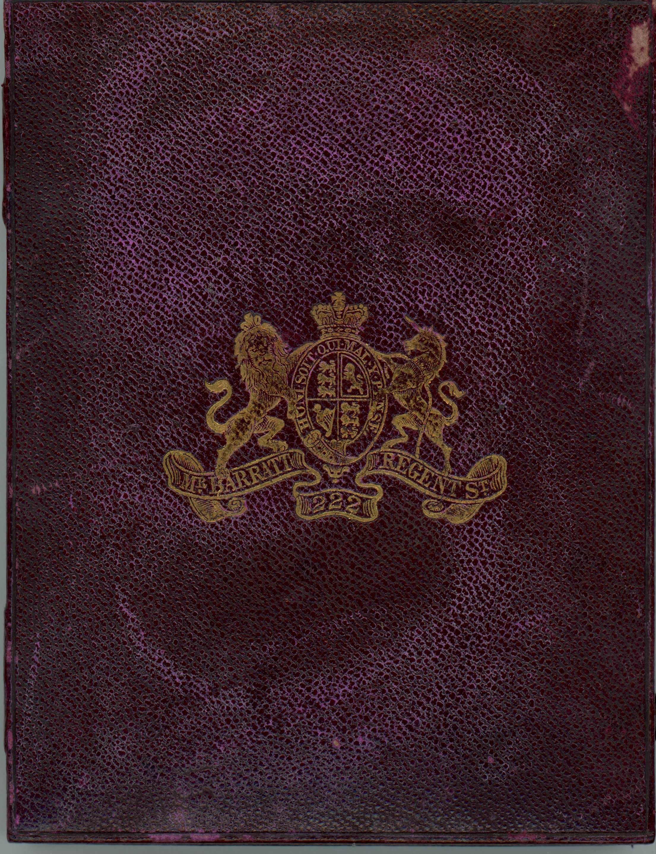 Case. A royal-purple rectangular leather case stamped with a gold insignia. A lion and unicorn flank a crowned coat of arms.
